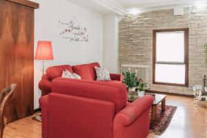 Un lugar para sentarse en Palladio Apartment - In Centro con Garage, Vista Fiume, Jacuzzi