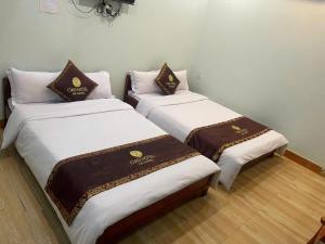 Ένα ή περισσότερα κρεβάτια σε δωμάτιο στο Ciao Homestay