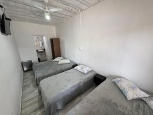 Postel nebo postele na pokoji v ubytování Pousada Fernandes + 36 fotografií