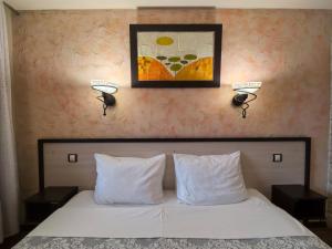 Postel nebo postele na pokoji v ubytování Complex Chilingira