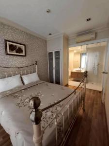 Ένα ή περισσότερα κρεβάτια σε δωμάτιο στο My Resort HuaHin