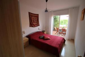 En eller flere senge i et værelse på Casa Chiqui