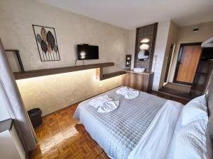 Postel nebo postele na pokoji v ubytování Complex Chilingira