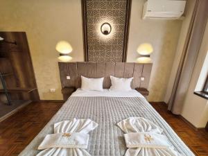 Postel nebo postele na pokoji v ubytování Complex Chilingira