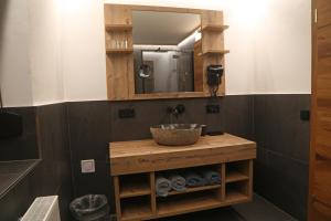 a bathroom with a sink and a mirror at Pension Embacher GmbH & Co KG in Viehhofen +48 photos
