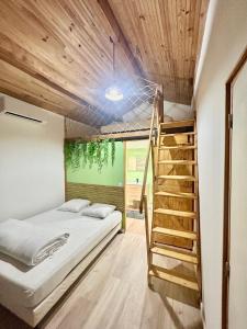 Postel nebo postele na pokoji v ubytování Le Mas Jubilé