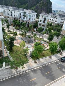 an aerial view of a city with buildings and trees at Square Hostel in Ha Long
