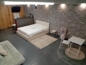 Ένα ή περισσότερα κρεβάτια σε δωμάτιο στο Le Loft