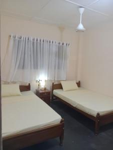 Кровать или кровати в номере Transit villas & Hostels