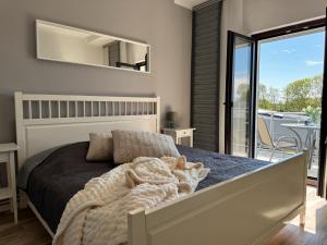 Кровать или кровати в номере Ferienwohnungen Briesenick Radde