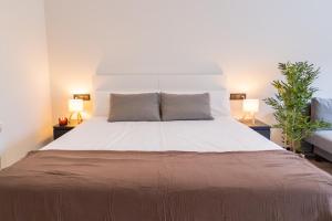 En eller flere senge i et værelse på Rental Room PZ100