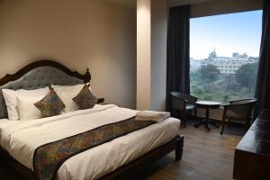 Ένα ή περισσότερα κρεβάτια σε δωμάτιο στο Hotel Rosemary Inn +44 φωτογραφίες