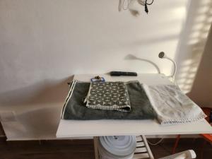 a table with a blanket on top of a bathtub at affittacamere alloggio olivo Empoli a pochi passi dalla stazione in Empoli