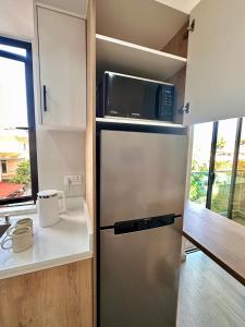 Η κουζίνα ή μικρή κουζίνα στο Sunkissed Haven