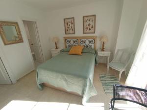 En eller flere senge i et værelse på Casa Bolema cx