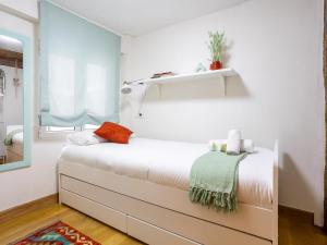 Ένα ή περισσότερα κρεβάτια σε δωμάτιο στο Balcón, luminoso, casco viejo, junto al ayuntamiento