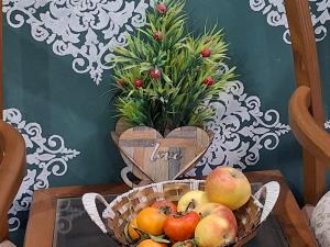 a basket of fruit on a table with a love heart at Sultan Resorts 7 star Luxurious accommodations  +56 photos