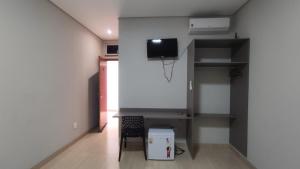 TV a/nebo společenská místnost v ubytování Urupês Hotel