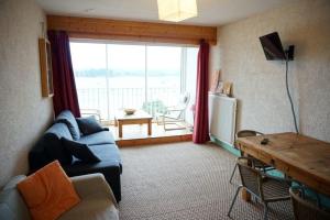 Χώρος καθιστικού στο Appartement avec SUPERBE VUE MER et terrasse, à 100m plages à TREGASTEL - Ref 97