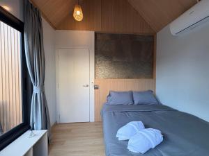 Postel nebo postele na pokoji v ubytování Stonea Pool Villa Pattaya + 19 fotografií