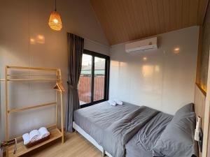 Postel nebo postele na pokoji v ubytování Stonea Pool Villa Pattaya