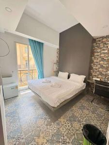 Ένα ή περισσότερα κρεβάτια σε δωμάτιο στο 君悦酒店