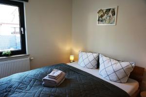 Ένα ή περισσότερα κρεβάτια σε δωμάτιο στο Haus am Fluss