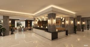 a lobby with a reception desk in a building at Hotel Riu Palace Nautilus - Adults Only in Torremolinos