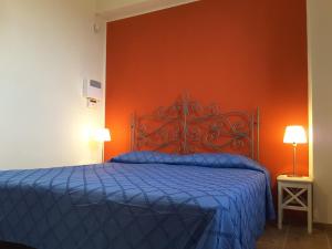 Postel nebo postele na pokoji v ubytování Casa nel Vigneto Erice