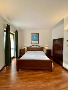 Ένα ή περισσότερα κρεβάτια σε δωμάτιο στο La Casa Dei Nonni