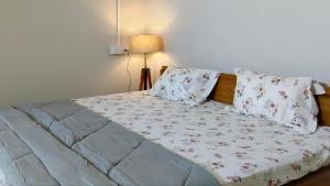 Ένα ή περισσότερα κρεβάτια σε δωμάτιο στο Oakwood HomeStay