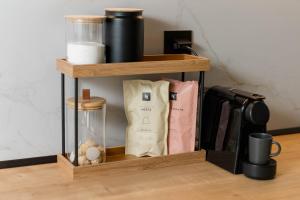 a wooden shelf with some items on top of it at Kyveli Lake Suite in Kastoria