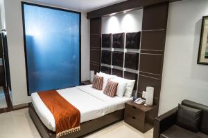 Postel nebo postele na pokoji v ubytování Hotel Prachi + 41 fotografií