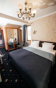 Ένα ή περισσότερα κρεβάτια σε δωμάτιο στο Hotel Afrodita