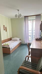 Ένα ή περισσότερα κρεβάτια σε δωμάτιο στο Osiedle Studenckie w Słubicach +12 φωτογραφίες