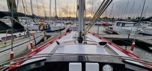 a boat docked in a harbor with other boats at Voilier de tout confort in Cherbourg en Cotentin