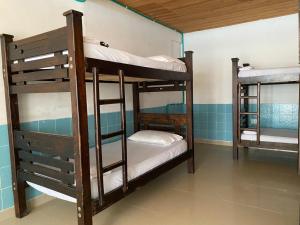 a group of bunk beds in a room at Hostal Hilltop Sapzurro in Zapzurro