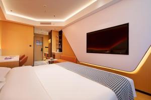 Postel nebo postele na pokoji v ubytování Boyue E-Sports Hotel