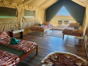 Ένα ή περισσότερα κρεβάτια σε δωμάτιο στο Camp Gecko - PRIVATE NATURE RESERVE; TENTED CAMP AND CAMPSITE