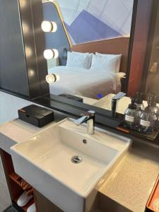 Ένα ή περισσότερα κρεβάτια σε δωμάτιο στο FunGee X