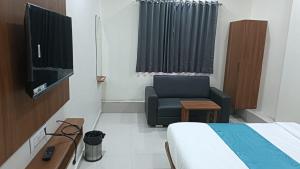 TV a/nebo společenská místnost v ubytování Hotel Empire