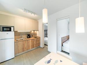 Kuchyň nebo kuchyňský kout v ubytování Apartments Arti Homes Rab Banjol + 33 fotografií