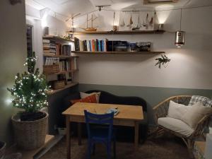 a dining room with a table and a christmas tree at An Koad - Cabane au bord de l'eau in Plougastel-Daoulas