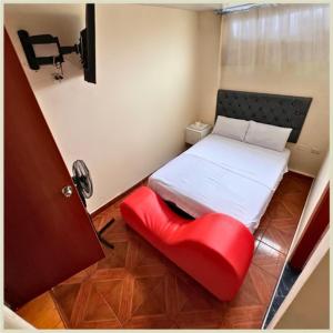 Ένα ή περισσότερα κρεβάτια σε δωμάτιο στο Hostal Las Vegas