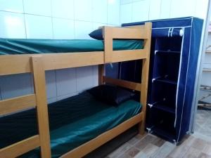 Litera o literas en una habitación de Home Enseada Beach