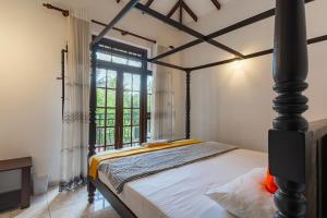 Ένα ή περισσότερα κρεβάτια σε δωμάτιο στο Tharan Villa - House in Colombo +39 φωτογραφίες