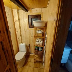 a small bathroom with a toilet and a sink at Zacisze in Uście +24 photos