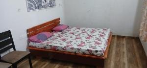 Giường trong phòng chung tại Budha Garden