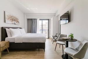 Ένα ή περισσότερα κρεβάτια σε δωμάτιο στο B48 Athens Dafni