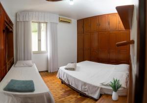 Postel nebo postele na pokoji v ubytování American Hostel e Pousada